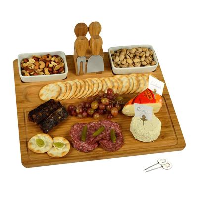 China Eniromentally sustainable with a groove around the exterior bamboo cheese cutting board for sale