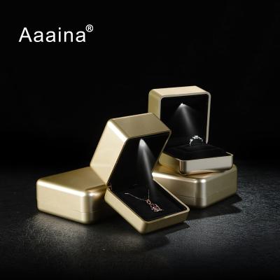 China Luxury Jewelry Box Matt Gold Led Light Jewelry Ring Box Custom Classic Elegant Vintage Aaania Logo for sale