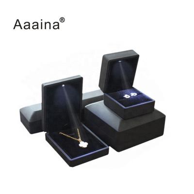 China Luxury Custom Logo Ring White Jewelry Packaging Black Leather Jewelry Box Led for sale