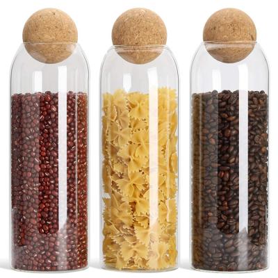 China Viable Seal Lid Wooden Ball Canisters Glass Wide Mouth Cork Bottle Sealed Clear Glass Food Storage Jar for sale