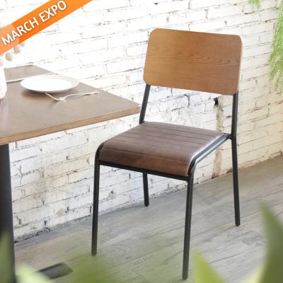 Китай High Quality Industrial Style Metal Frame Stacking Chair With Plywood Back Vintage PU Leather Dining Chairs продается