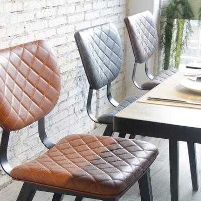 China New Design Cavity Section Square Cafe Bistros Soft Cushion Real PU Leather Woven Back Leather Chair Restaurant Furniture Luxury Woven Furniture for sale