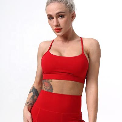 China Promotional Pink Red Elastic Tight Women's Breathable Gather Yoga Vest Strap Backless Sexy Sports Bra Fitness Tops Women for sale