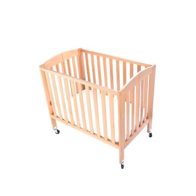 China New Beech 2 Height Foldable Baby Crib ES6112 Adjustable High Quality Safe Wooden Baby Hutch Set Natural Wood Color for sale