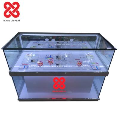 China 2022 Fashion Custom Design Luxury Smart Phone Display Cabinet Glass Metal Showcase Display for sale