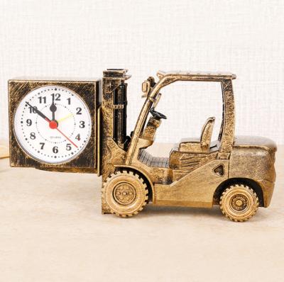 China Hot Selling Art and Craft 9inch 23cm Retro Style Cartoon Design Golden Forklift Antique Table Clock for Kids Table for sale