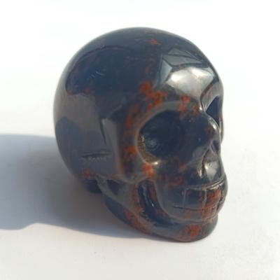 China China Wholesale Natural Obsidian Crystal Carved Skulls Red Hand-Carved Skulls Illustration for sale