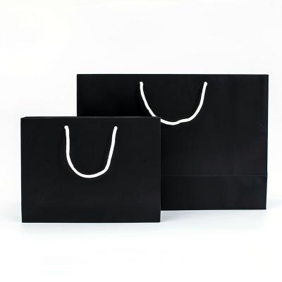 China Recycled Materials Fashion Simple Portable Shopping Tote Bags Eco - Friendly Recyclable Black Kraft Paper Bags With Handle for sale