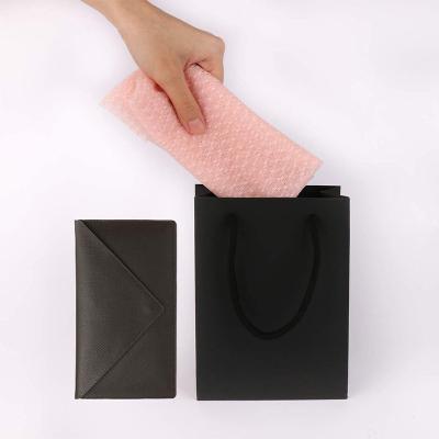 China Recycled Materials Manufacturer Supply Exquisite Business Gift Packaging Bags Eco - Friendly Black Cardboard Paper Bags With Handles for sale