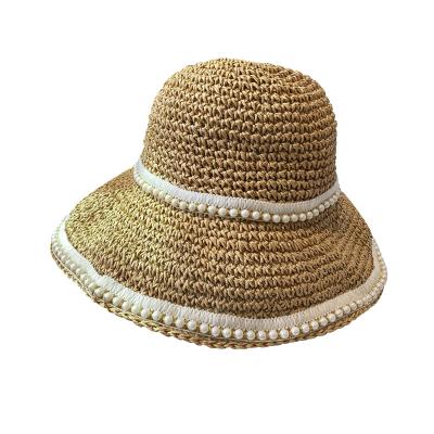 China Hollow Handmade Beach Straw Hats With Pearls Straw Sun Hat Korean Wide Brim Bucket Hat Sunscreen Paper Summer Women Image for sale