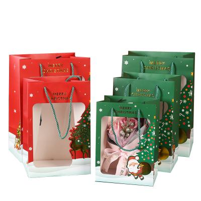 China Recyclable Christmas Gift Bags With Handle Hot Stamping Embossing Printing Luxury Pack Transparent Embossing Paper Bags for sale