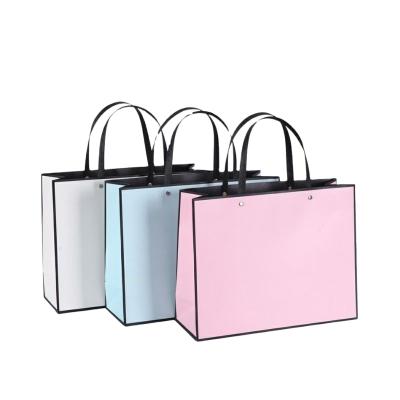 China Custom Recycled Materials Paper Bag Gift Bag Tote Bag With Ribbon Handle For Shopping Festival Boutiquec For Packaging for sale