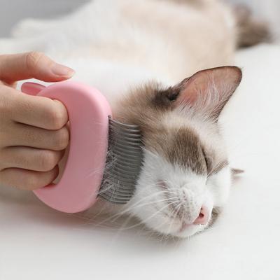 China Sustainable Pet Massage Brush Shell Shaped Handle Pet Grooming Massage Tool To Remove Loose Hair Only For Cats for sale