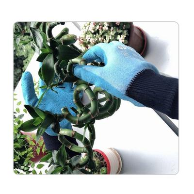 China 15 Gauge Blue Elastic Polyester Liner Landscaping Latex Gloves for sale