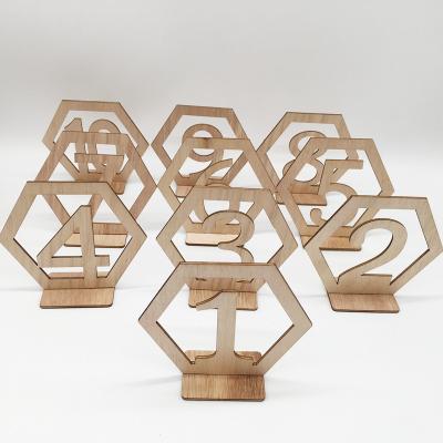 China Wooden Wedding Event Party Supplies Hollowed 1-20 Wooden License Plate Hexagon Digit Table Place Cards for sale