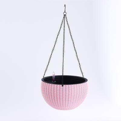 China Modern Rattan Self Watering Plastic Hanging Basket Flower Pot Home Balcony Decorative Garden Round Plant Pot for sale