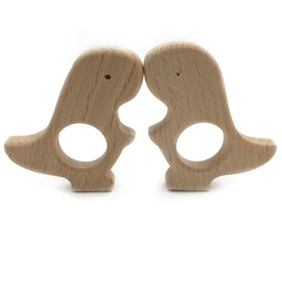 China Wholesale Diy Wooden Food Grade Beech Soothing Baby's Teething Pain Opener Wooden Baby Dinosaur Grabber Toys for sale