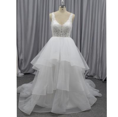 China Anti-Static V-neck Puffy Wedding Dress Beaded Applique And Organza Bridal Gown For Women for sale