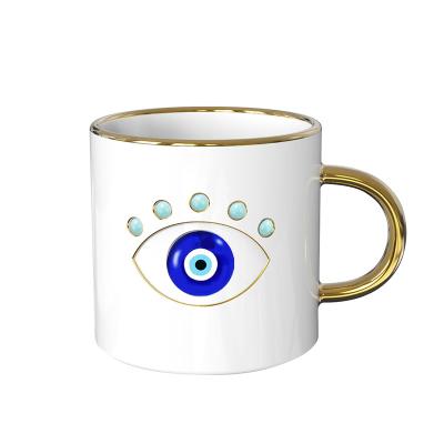 China Protection Viable Spiritual Power Ceramic Evil Eye Coffee Mug Ceramic Healing Base White Base Magic Tea Mug for sale