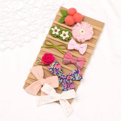 China Cute children's headdress bow tie flower hair accessories about 33 cm small beauty brand new seamless headband for sale