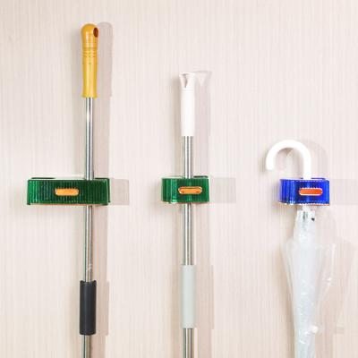 China Storage Sustainable Tools Wipe Holder Wall Mount Broom And Broom Holder Plastic Broom Frame for sale