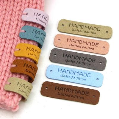 China Sustainable Knitting Accessories Limited Edition 54x15MM Sew Tags Handmade Labels For Clothes Leather Label for sale