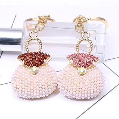 China Promotion Gift Fashion Alloy Exquisite Bling Crystal Pearl Handbag Car Ornament Key Chain for sale