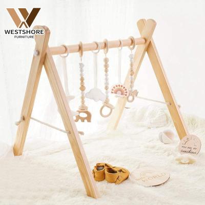 China Foldable Inflatable Baby Play Gym Frame Activity Gym with 3 Wooden Baby Teether Toys Nordic Montessori Baby Gym for sale