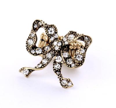 China Latest Design Vintage ALLOY Gold Band Ring Bowknot Design Stretch Band Expandable Rings Big Bow Crystal Ring for sale