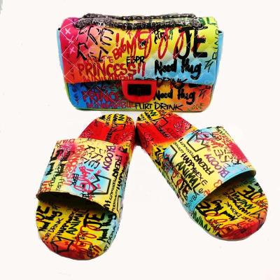 China PVC+ EVA New graffiti slippers black color graffiti bag with slippers summer sslides kids adult slippers for sale