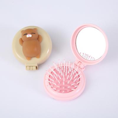 China Portable Round Makeup Mirror Beauty Comb Folding Decompression Music Pinch Travel Airbag Comb for sale