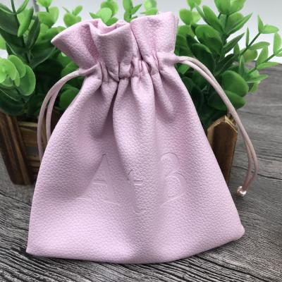 China Recyclable Custom Leather PU Jewelry Pouch Bag With Emboss Logo for sale