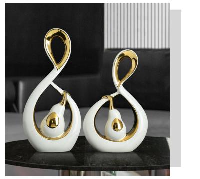 China Nordic Luxury Minimalist Couples Elephant Gold Plated White Porcelain Ornaments Unique Ceramic Creative Deco Shape Art Home Decoration for sale