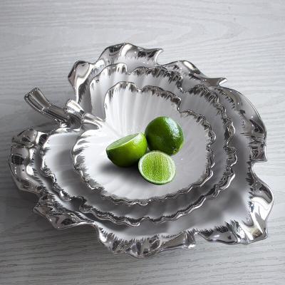 China Viable Nordic porcelain plates fruit candy and snack tray designed unique leaf shape silver rim ceramic plate dish crafts for sale