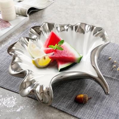 China Sustainable Ginkgo Leaf Shape Nordic Porcelain Dishes Fruit Candy And Snack Dish Designed Unique Silver Rim Ceramic Dish Compote for sale