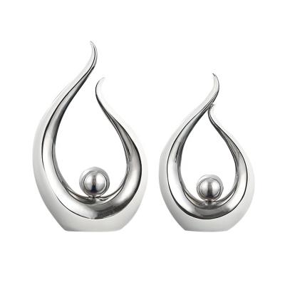 China Modern Nordic Minimalist Unique Creative Decoration Art Shape Ceramic Home Decor Ornaments Silver Ceramic Ornament for sale