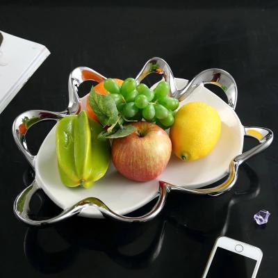 China Sustainable Originality Designed Unique Nordic Irregular White Ceramic Fruit Dish Ripple Shape Compotes Candy Dishes And Snack Tray for sale