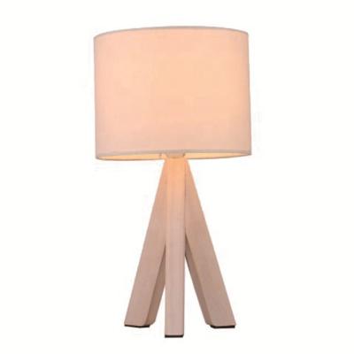 China Modern Cheap Small Bed Table Lamp With Tripod Base And Wood Fabric Shade for sale