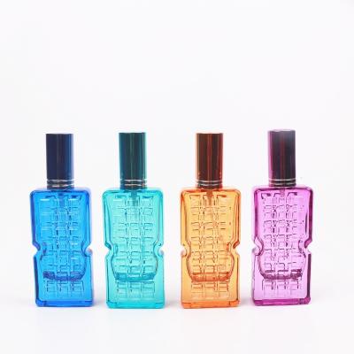 China Cosmetic Spray glass bottle 35ML square colorful perfume glass bottle with colorful aluminum pump for sale