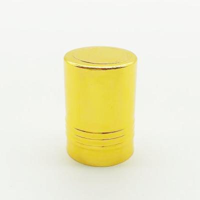 China Non Spill Wholesale High Quality Shiny golden Engraved Logo Aluminum caps for perfume glass bottles for sale