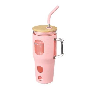 China Viable Newcomer Glass Tumblers With Handle Straw Bamboo Lid Silicone Scale Travel Glass Mug for sale