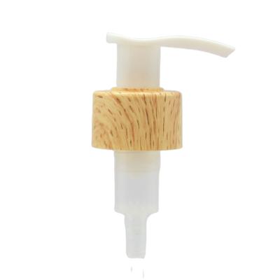 China Non Reverse Wooden Outer Spring Lock Left Right Hand Lotion Dispenser Pump With Clip for sale