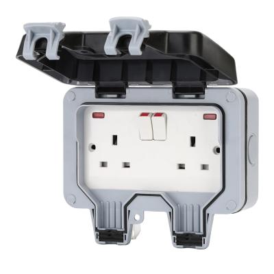 China Residential/Multi-Purpose Electric Waterproof Wall Box Factory Switch Stock Outlet Waterproof Electrical Box Cover Switch And Socket Outside UK Plug for sale