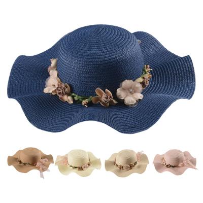 China Ladies Comfortable Cheap Price Summer Large Wave Flower Sun Hats Bow Silk Beach Outdoor Sunscreen Straw Hat for sale