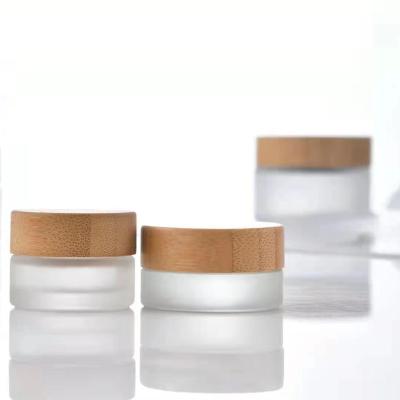 China Wholesale Custom Glass Cosmetic Spice Factory Packaging Clear Skin Care Jar Cosmetic Storage Jar With Bamboo Lids Set For Cosmetic Cream In Stock for sale