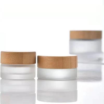 China Wholesale Custom Thick Clear Glass Cosmetic Packaging 10g 30g 50g Skin Care Storage Spice Jar With Bamboo Lids Set For Cosmetic Cream for sale