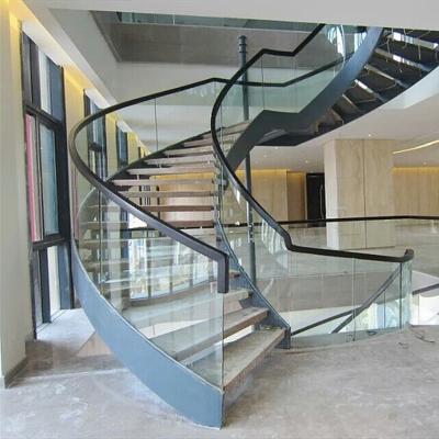 China Modern Steel Structure Stairs Indoor Tile Tread Curved Stairs Design With Glass Enclosure Factory for sale