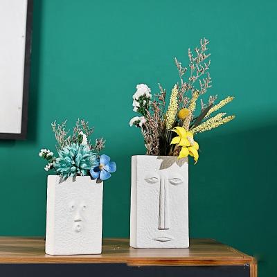 China Nordic Modern Ceramic Home Abstract Hotel Face Handicraft Style Vase Garden Decoration Desktop Ornaments for sale