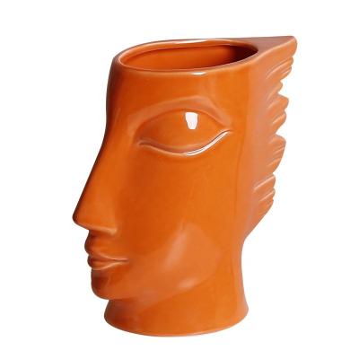 China Nordic garden decoration craft modern abstract home ceramic custom face vase for hotel office desk decoration for sale