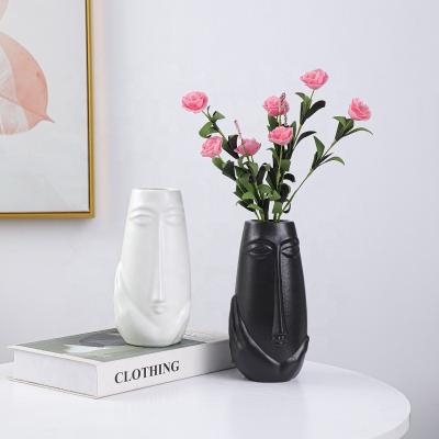 China Creative hot sale black and white abstract face design modern home garden ceramic vase decoration for wedding home office decoration for sale